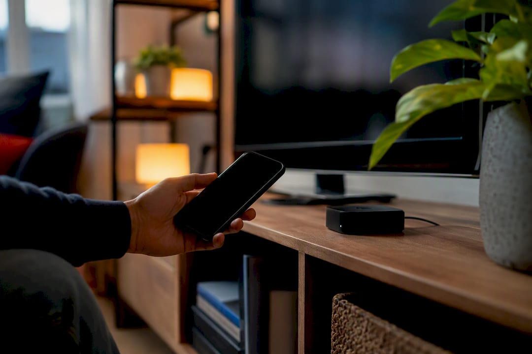 Hand streaming iPhone content to Apple TV via AirPlay